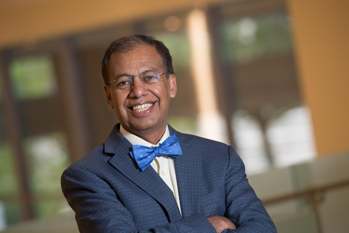 Thuluvath Arms Crossed Suit and Bow Tie.jpg