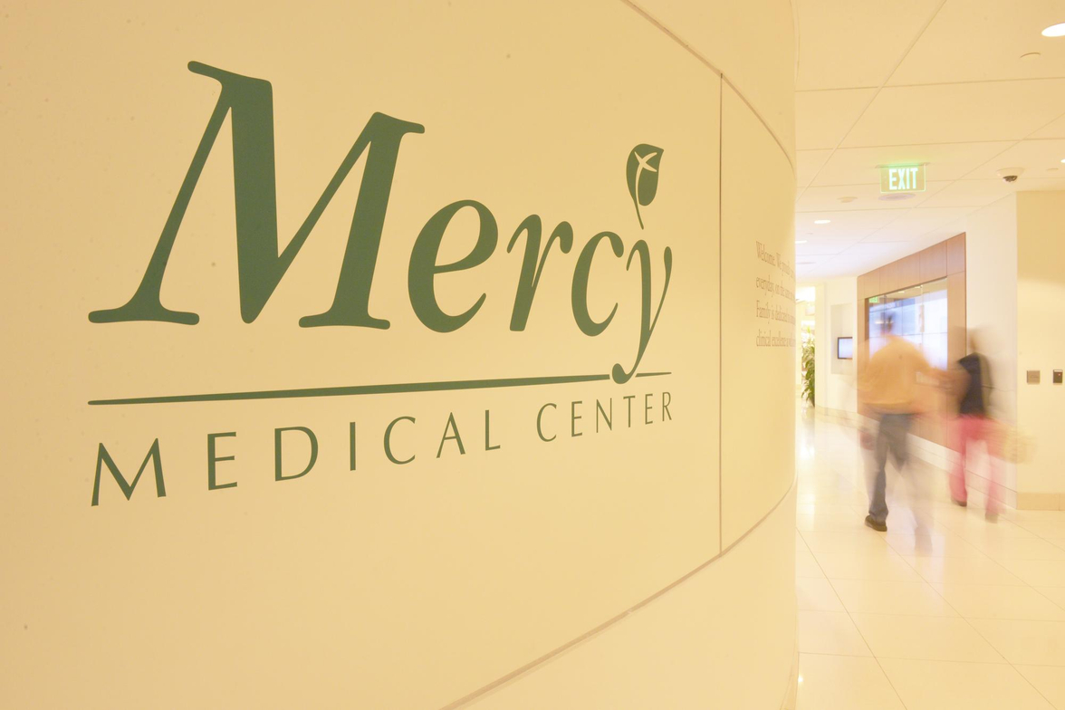 Mercy_Logo_Bunting_Hallway_People_Walking_Through_2013_6108.JPG